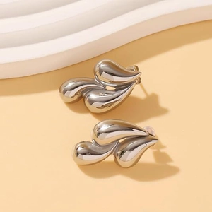 Minimalist silver triple teardrop stud earrings with polished layered streamline design