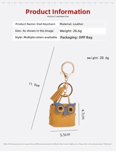 Detailed view of yellow leather owl keychain with blue eye accents and size measurements