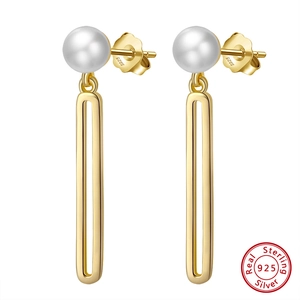 Elegant 925 sterling silver drop earrings featuring natural baroque pearls in gold finish