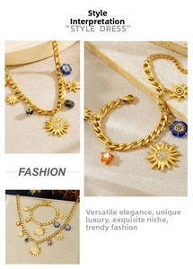 Detail of chunky gold chain necklace and bracelet with sun charm and acrylic accents
