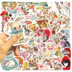 Close-up of vintage pink cartoon animal stickers featuring bears and bunnies for DIY decor