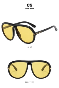 Dettaglio montatura aviator con cerniera a T in metallo e lenti gialle