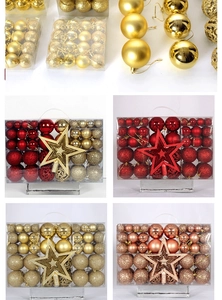 Detailed close-up of mixed Christmas ball set with glitter, matte and star topper