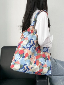 Floral canvas tote bag with abstract print shown on model for a casual summer style