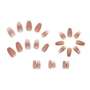 Pink gradient coffin press-on nails with purple flower details and gold glitter accents