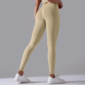 Detail of high-waist seamless khaki yoga leggings with body-shaping butt-lift design