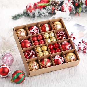 Detailed set of red and gold Christmas ball ornaments in a brown gift box arrangement
