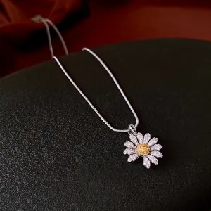 Elegant daisy pendant necklace with sparkling cubic zirconia on a silver-plated chain
