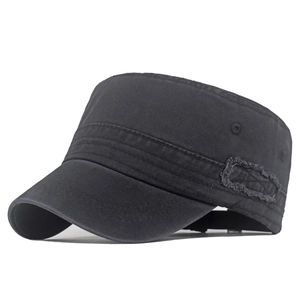 Close-up of washed cotton canvas detail and frayed patch on dark grey cadet hat