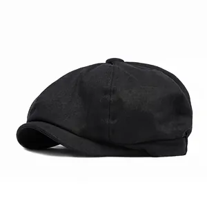 Classic black cotton newsboy cap with an adjustable eight-panel vintage flat top design