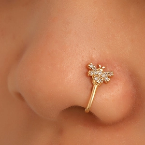 Gold bee nose cuff with cubic zirconia accents for non-pierced noses on a model