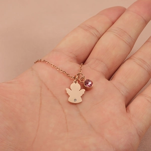 Rose gold angel pendant necklace with pink birthstone on an elegant neck model