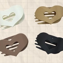 Heart-shaped matte acrylic hair claw clips in four neutral colors for elegant updos