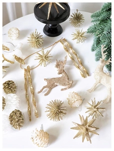 Macro detail of champagne gold glitter reindeer, star and pinecone Christmas tree ornaments