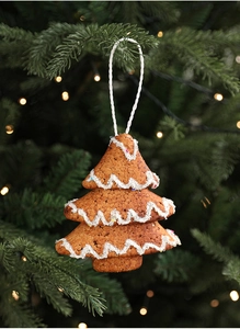 Close-up of a gingerbread brown foam Christmas tree ornament with white icing detail