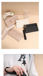 Detail von gewebten Stroh-Clutch-Taschen mit Doppelreißverschluss und Handschlaufe