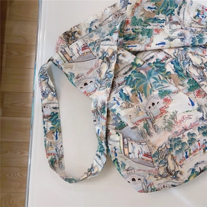 Detailed top view of a large cotton tote bag featuring traditional Chinese landscape art