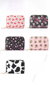 Selection of slim card holder wallets featuring cherry, bee, and cow pattern prints