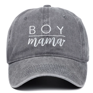 Close-up of BOY mama white embroidery on washed dark grey cotton baseball cap