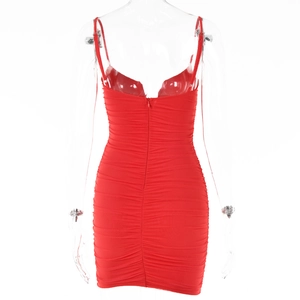 Detail of red ruched bodycon dress showing the sexy V-neck and backless strap design