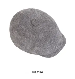 Top down view of a vintage dark grey newsboy cap with white flecked texture and button top