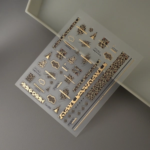 Macro view of leopard print nail sticker with gold foil and geometric patterns Co-263