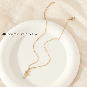Elegant gold snake pendant necklace with white and red zircon stones on a high-quality O-chain