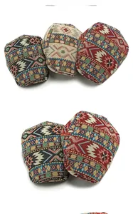 Detailed view of bohemian jacquard fabric textures on vintage style beret hats