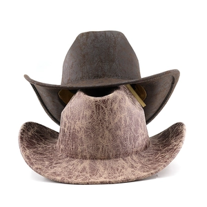 Vintage cracked-texture western cowboy hats in dark brown and tan felt on white background