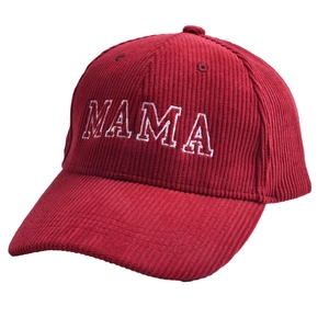 Close-up of wine red corduroy baseball cap with white MAMA embroidery on a white background