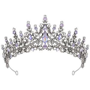 Detailed view of dark metal crown with sparkling purple crystals and clear rhinestones
