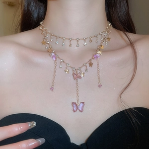 Close-up detail of double-layer necklace with purple resin butterflies and crystals