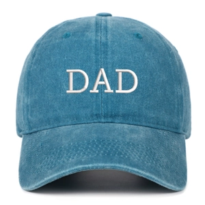 Close-up of the vintage washed blue cotton fabric and white DAD embroidery on the baseball cap