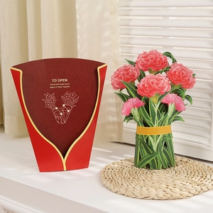 3D popup Mother's Day card with pink carnation bouquet and red envelope on windowsill