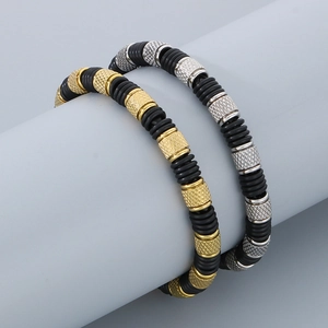 Detail view of men's beaded bracelets with metallic knurled beads and black rubber rings