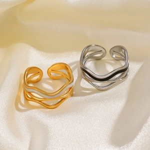 Minimalist wavy enamel stainless steel open rings in gold and silver on silk fabric