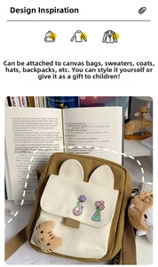 Creative chemistry flask pins with floral designs pinned onto a canvas bag