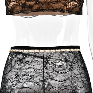 Detail of black lace lingerie set with elegant metal chain belt on waistline