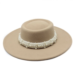 Detail of light khaki wool felt boater hat with elegant multi-layer pearl embellishments