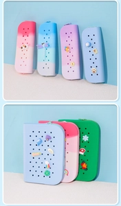 Detail of DIY silicone pencil case showing colorful gradient designs and cute cartoon charms