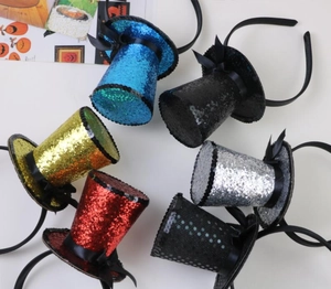 Top view of six assorted sequin mini top hat headbands for Halloween party decorations