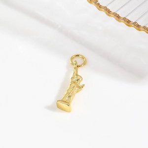 Macro shot of an 18k gold plated Statue of Liberty charm for DIY jewelry making