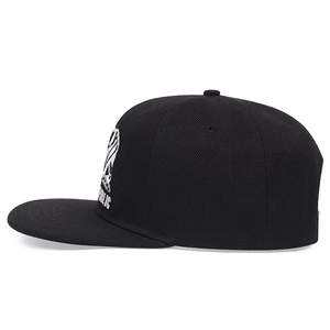Black street style baseball cap with white Republic embroidery in side view