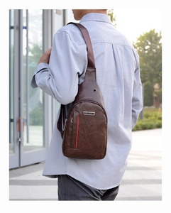 Brown leather crossbody sling bag for men with adjustable strap and zip pockets