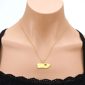 Golden titanium steel Puerto Rico map pendant necklace with a cutout heart on a model