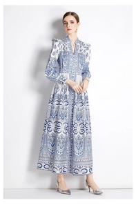 Detail of blue and white porcelain print on a vintage V-neck long-sleeve maxi dress