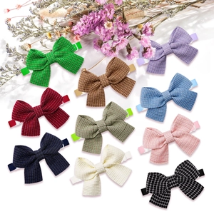 Set of 10 colorful fabric pet bowties for dogs and cats in minimalist solid colors