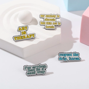 Art Is Therapy set of four colorful enamel pins with creative English quotes