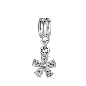 DIY five-petal flower charm featuring teardrop cubic zirconia and white gold plating