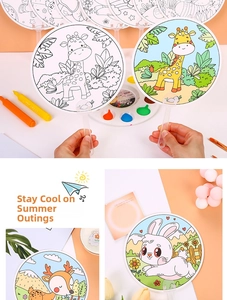 Macro view of DIY kids round fans with cartoon animal outlines for creative coloring